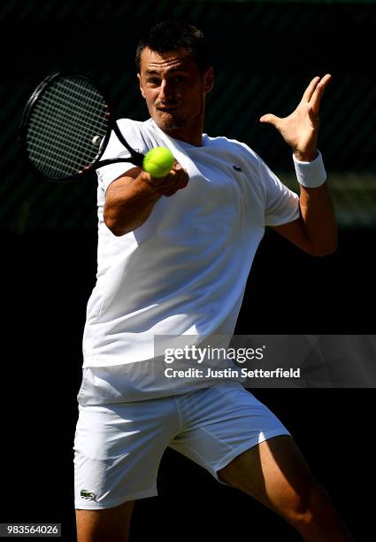 Bernard Tomic of Australia in action against Matteo Donati of Italy during the Wimbledon Lawn Tennis Championships Qualifying at The Bank of England...