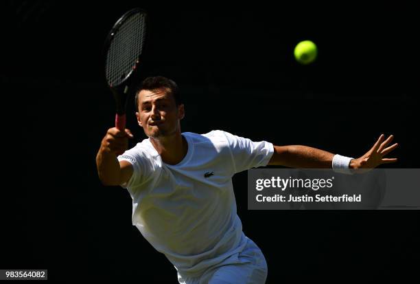 Bernard Tomic of Australia in action against Matteo Donati of Italy during the Wimbledon Lawn Tennis Championships Qualifying at The Bank of England...