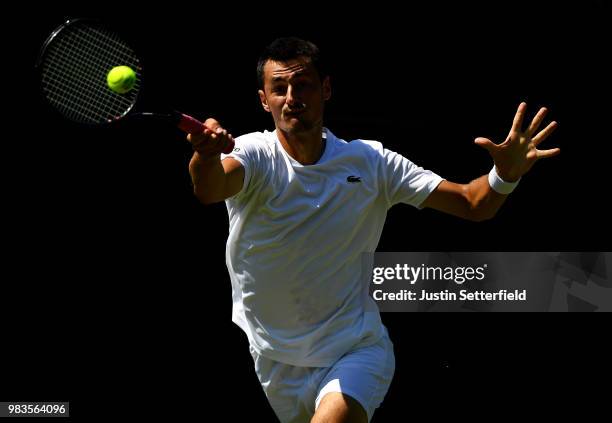 Bernard Tomic of Australia in action against Matteo Donati of Italy during the Wimbledon Lawn Tennis Championships Qualifying at The Bank of England...