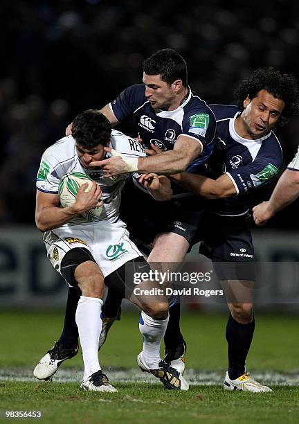 Anthony Floch of Clermont is tackled by Rob Kearney during the Heinken Cup quarter final match between Leinster and Clermont Auvergne at the RDS on...