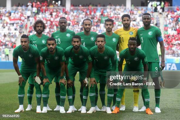 The Saudi Arabia players pose for a team photo prior to the 2018 FIFA World Cup Russia group A match between Saudia Arabia and Egypt at Volgograd...