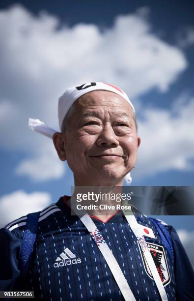 Japanese fans pose for portraits prior to the 2018 FIFA World Cup Russia group H match between Japan and Senegal at Ekaterinburg Arena on June 24,...