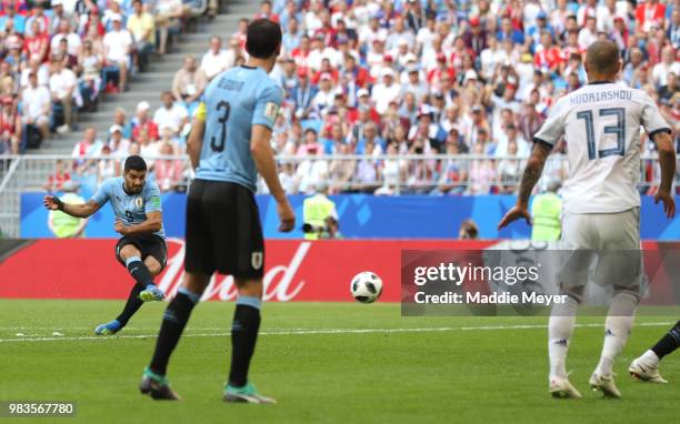 Luis Suarez of Uruguay scores his team's first goal during the 2018 FIFA World Cup Russia group A match between Uruguay and Russia at Samara Arena on...