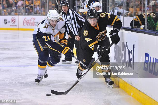 David Krejci of the Boston Bruins skates with the puck against Drew Stafford of the Buffalo Sabres at the TD Garden on April 8, 2010 in Boston,...