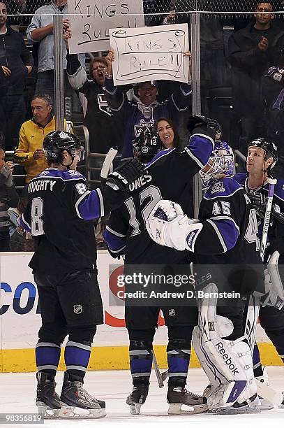 Randy Jones, Drew Doughty, Jonathan Bernier and Ryan Smyth of the Los Angeles Kings celebrate a win over the Vancouver Canucks during the game on...