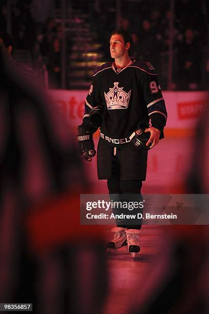 Ryan Smyth of the Los Angeles Kings stands on the ice during the singing of the National Anthem prior to the game against the Vancouver Canucks on...