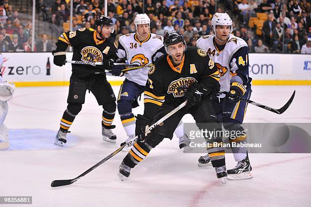 Patrice Bergeron of the Boston Bruins watches the play against Andrej Sekera of the Buffalo Sabres at the TD Garden on April 8, 2010 in Boston,...