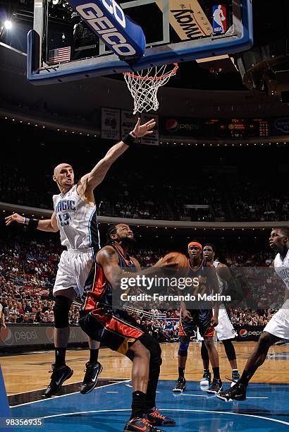 Ronny Turiaf of the Golden State Warriors looks to score against Marcin Gortat of the Orlando Magic during the game on March 3, 2010 at Amway Arena...