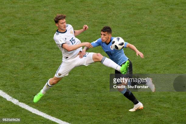 Vladimir Granat of Russia tackles Lucas Torreira of Uruguay during the 2018 FIFA World Cup Russia group A match between Uruguay and Russia at Samara...