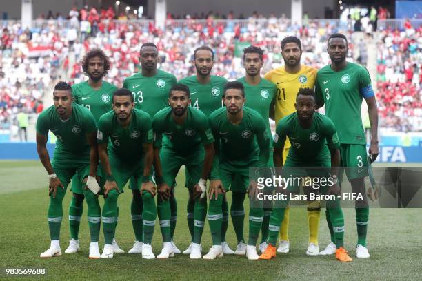 The Saudi Arabia players pose for a team photo prior to the 2018 FIFA World Cup Russia group A match between Saudia Arabia and Egypt at Volgograd...