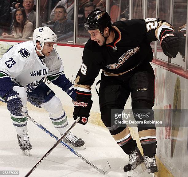 Kyle Chipchura of the Anaheim Ducks battles for the puck against Alexander Edler of the Vancouver Canucks during the game on April 2, 2010 at Honda...