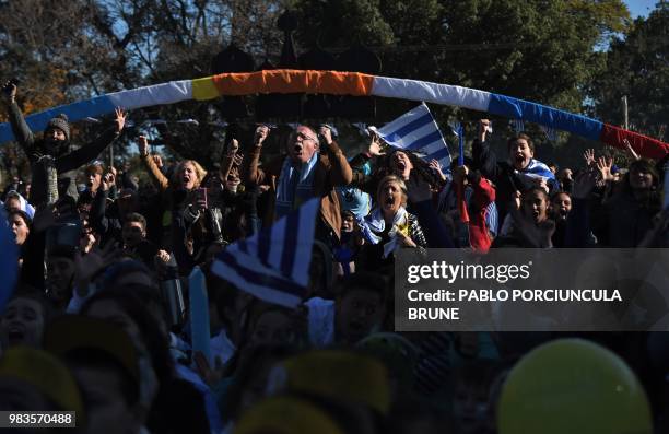 Uruguay's Tourism and Sport Minister Liliam Kechichian and Rio Negro Department Mayor Oscar Terzaghi celebrate after Uruguay's striker Luis Suarez...