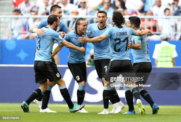Diego Laxalt of Uruguay celebrates with teammates after scoring his team's second goal during the 2018 FIFA World Cup Russia group A match between...