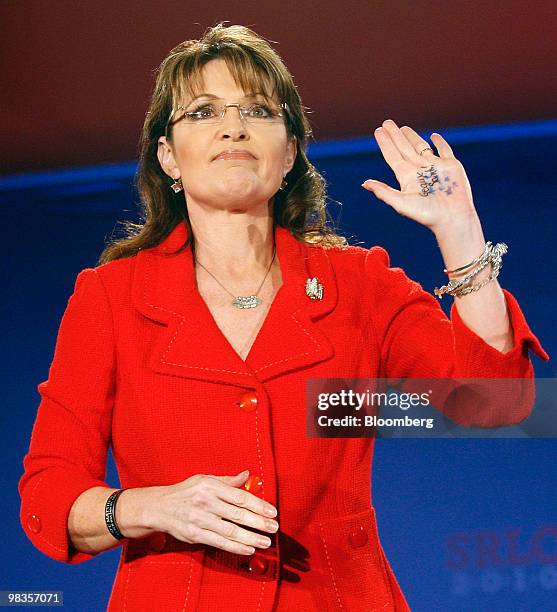 Sarah Palin, former governor of Alaska and 2008 vice-presidential candidate, waves to the crowd after speaking at the Southern Republican Leadership...