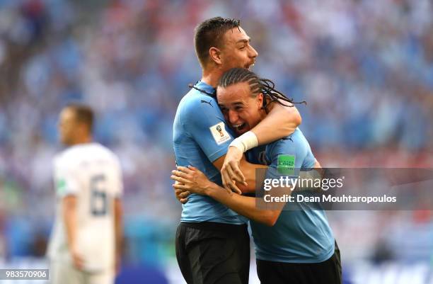 Diego Laxalt of Uruguay celebrates with teammate Sebastian Coates after scoring his team's second goal during the 2018 FIFA World Cup Russia group A...