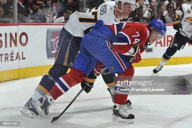 Sergei Kostitsyn of Montreal Canadiens battles for the puck with Tyler Myers of Buffalo Sabres during the NHL game on April 3, 2010 at the Bell...
