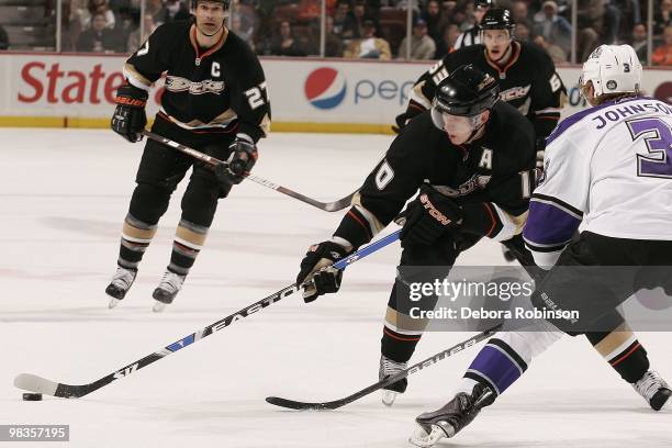 Jack Johnson of the Los Angeles Kings defends against Corey Perry of the Anaheim Ducks during the game on April 6, 2010 at Honda Center in Los...