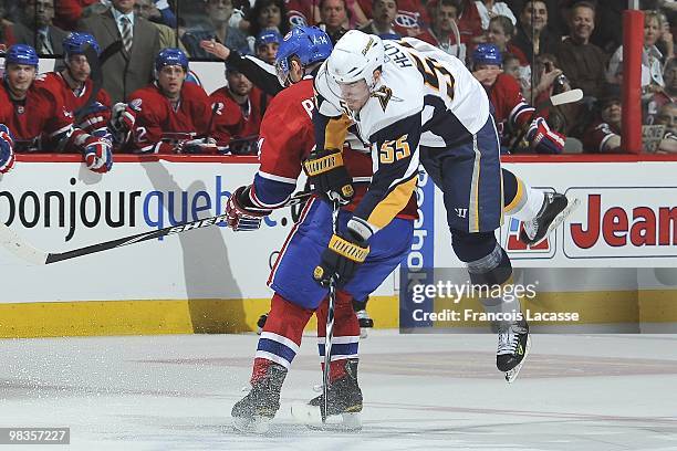 Jochen Hecht of Buffalo Sabres jumps over Tomas Plekanec of Montreal Canadiens during the NHL game on April 3, 2010 at the Bell Center in Montreal,...