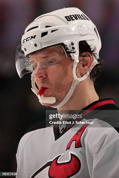 Patrik Elias of the New Jersey Devils chews on a mouth guard during a break in the action against the Florida Panthers at the BankAtlantic Center on...