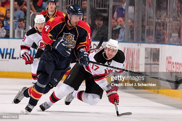 Radek Dvorak of the Florida Panthers tangles with Ilya Kovalchuk of the New Jersey Devils at the BankAtlantic Center on April 8, 2010 in Sunrise,...