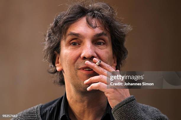 German theatre director Christian Stueckl smokes a cigarette ahead of a passion play rehearsal on April 9, 2010 in Oberammergau, Germany. The...