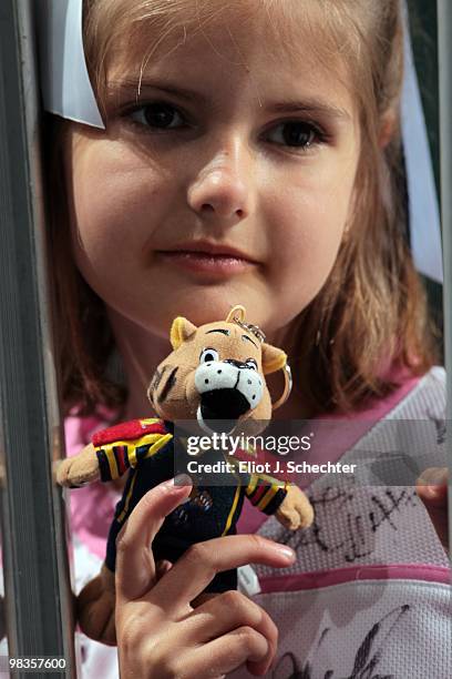 Florida Panthers fan Sabrina Benson holds her Stanley C. Panther doll while waiting for the team to come out to the ice prior to the start of the...