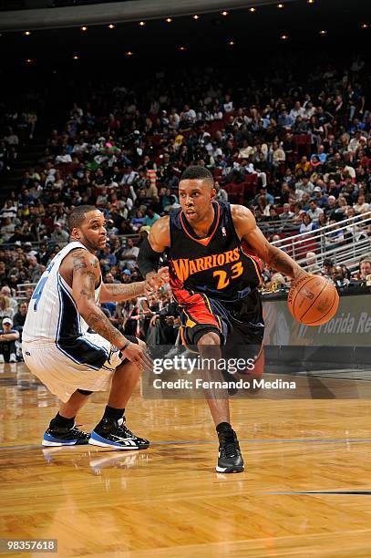 Watson of the Golden State Warriors moves the ball against Jameer Nelson of the Orlando Magic during the game on March 3, 2010 at Amway Arena in...