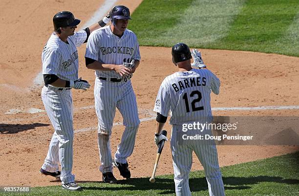 Troy Tulowitzki and Brad Hawpe of the Colorado Rockies celebrate after they scored in the fourth inning against the San Diego Padres during MLB...