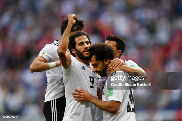 Mohamed Salah of Egypt celebrates with teammate Marwan Mohsen after scoring his team's first goal during the 2018 FIFA World Cup Russia group A match...