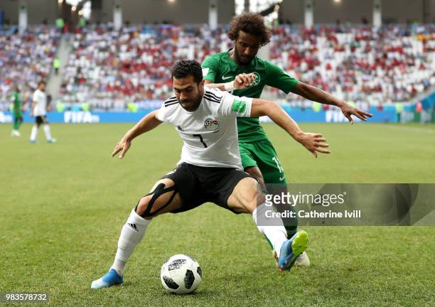 Ahmed Fathi of Egypt is challenged by Yasir Alshahrani of Saudi Arabia during the 2018 FIFA World Cup Russia group A match between Saudia Arabia and...