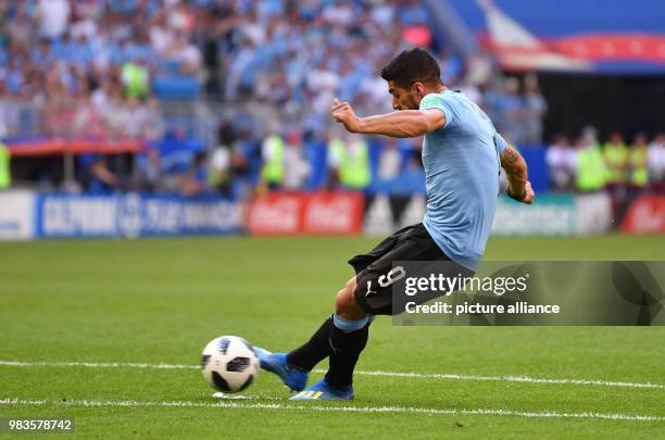 June 2018, Russia, Samara: Soccer: World Cup, group stages, group A, 3rd matchda: Uruguay vs Russia, at Samara Stadium. Uruguay's Luis Suarez scores...