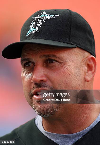 Manager Fredi Gonzalez of the Florida Marlins watches players take batting practice before taking on the Los Angeles Dodgers during the Marlins home...