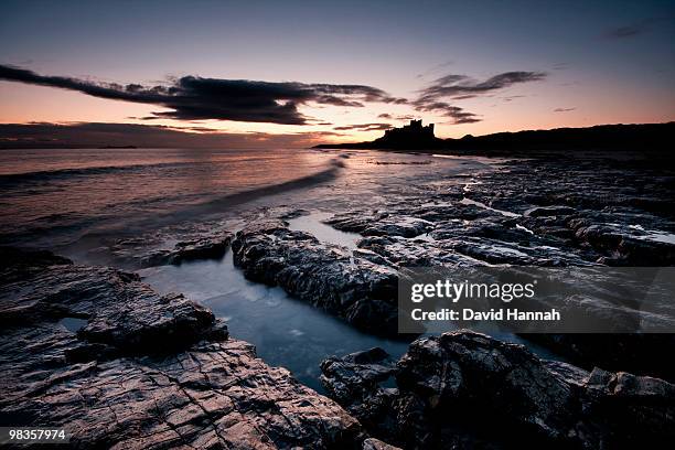 dawn bamburgh castle, northumberland - bamburgh stock pictures, royalty-free photos & images