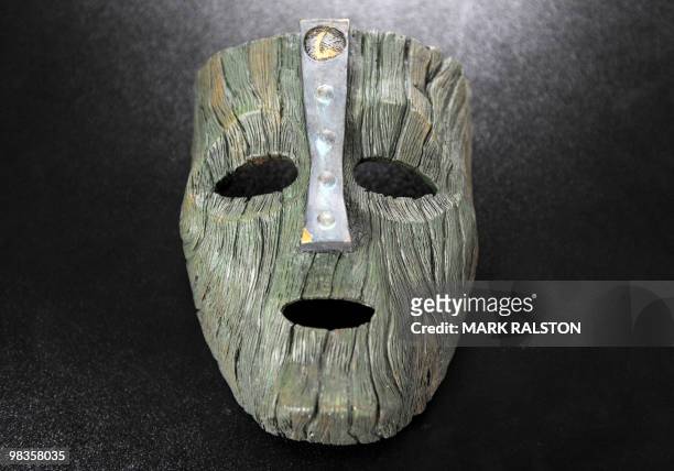 Screen-worn prop mask of Loki, the Norse God of Mischief from the Jim Carey movie "The Mask" is displayed with other movie memorabilia at the...