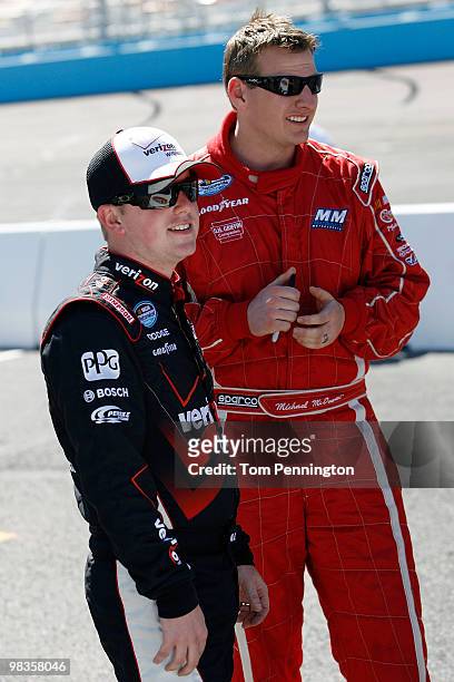 Justin Allgaier, driver of the Verizon Wireless Dodge, with Michael McDowell, driver of the Roto-Rooter Dodge, on the grid during qualifying for the...