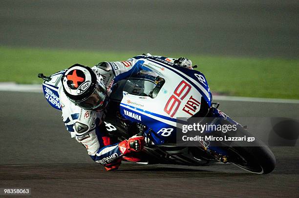 Jorge Lorenzo of Spain and Fiat Yamaha Team rounds the bend during the free practice session during the official photo session at Losail Circuit on...