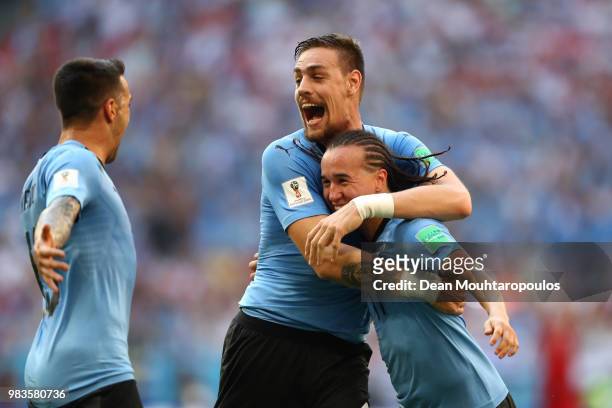 Diego Laxalt of Uruguay celebrates with teammate Sebastian Coates after scoring his team's second goal during the 2018 FIFA World Cup Russia group A...