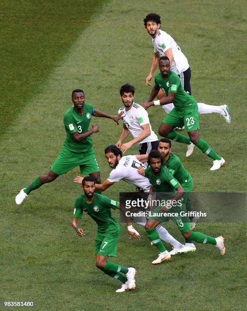 Egypt and Saudi Arabia players look to compete for the ball during the 2018 FIFA World Cup Russia group A match between Saudia Arabia and Egypt at...