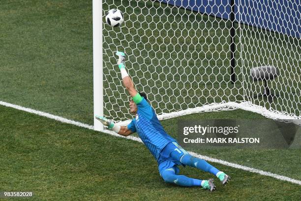 Egypt's goalkeeper Essam El Hadary dives to save a penalty during the Russia 2018 World Cup Group A football match between Saudi Arabia and Egypt at...