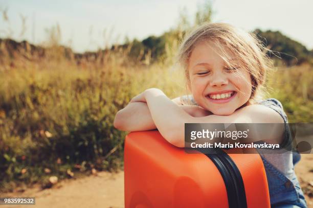 https://media.gettyimages.com/id/983592532/photo/happy-child-girl-with-suitcase-travelling-on-summer-vacation-kid-going-to-countryside-cozy.jpg?s=612x612&w=gi&k=20&c=rm4dY2FW6EgAi-FW0VcPsGe3XHJvQKYCqyHe6AgCSLQ=