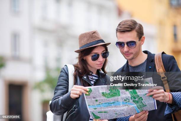 happy tourist couple traveling on holidays in europe smiling happy. caucasian couple. - happy holidays around the world stock pictures, royalty-free photos & images