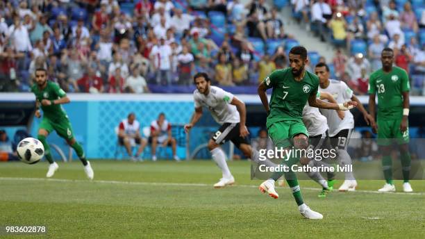 Salman Alfaraj of Saudi Arabia scores a penalty for his team's first goal during the 2018 FIFA World Cup Russia group A match between Saudia Arabia...