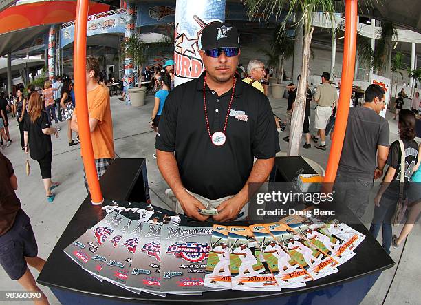 Vendor sells programs before the Los Angeles Dodgers take on the Florida Marlins during the Marlins home opening game at Sun Life Stadium on April 9,...