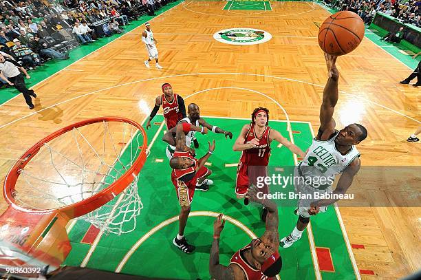 Kendrick Perkins of the Boston Celtics puts a shot up over Anderson Varejao and LeBron James of the Cleveland Cavaliers during the game on February...