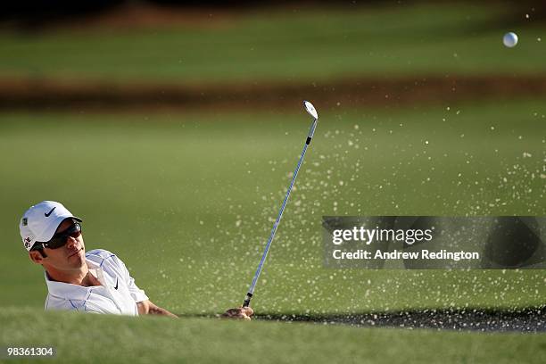 Paul Casey of England plays from a bunker on the 18th hole during the second round of the 2010 Masters Tournament at Augusta National Golf Club on...