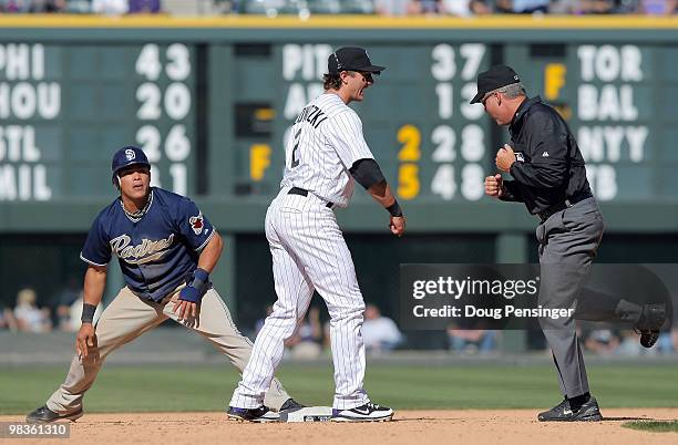 Shortstop Troy Tulowitzki of the Colorado Rockies reacts as second base umpire Tim Timmons calls out Everth Cabrera of the San Diego Padres after he...