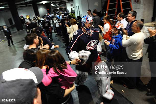 Goaltender Steve Mason of the Columbus Blue Jackets walks through the "Tunnel of Pride" before taking the ice at the start of the their game against...