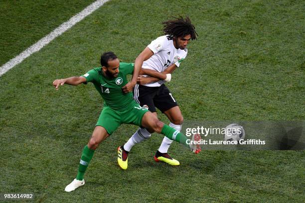 Abdullah Otayf of Saudi Arabia battles for possession with Mohamed Elneny of Egypt during the 2018 FIFA World Cup Russia group A match between Saudia...