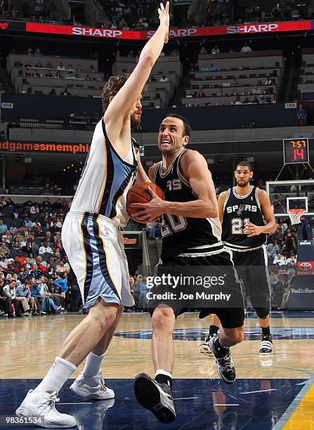 Manu Ginobili of the San Antonio Spurs drives to the basket against Marc Gasol of the Memphis Grizzlies during the game at the FedExForum on March 6,...