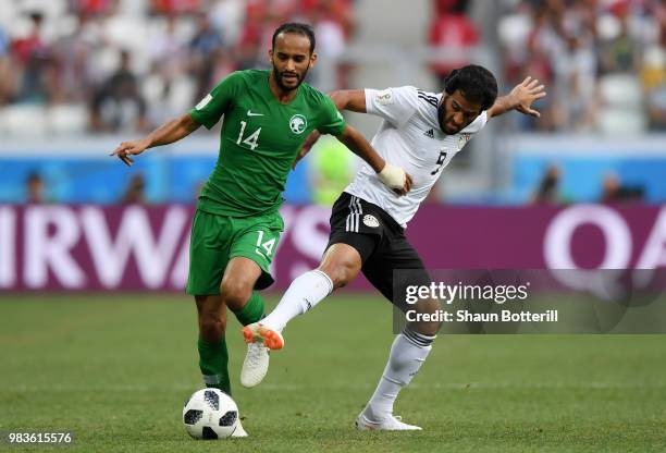 Abdullah Otayf of Saudi Arabia battles for possession with Marwan Mohsen of Egypt during the 2018 FIFA World Cup Russia group A match between Saudia...